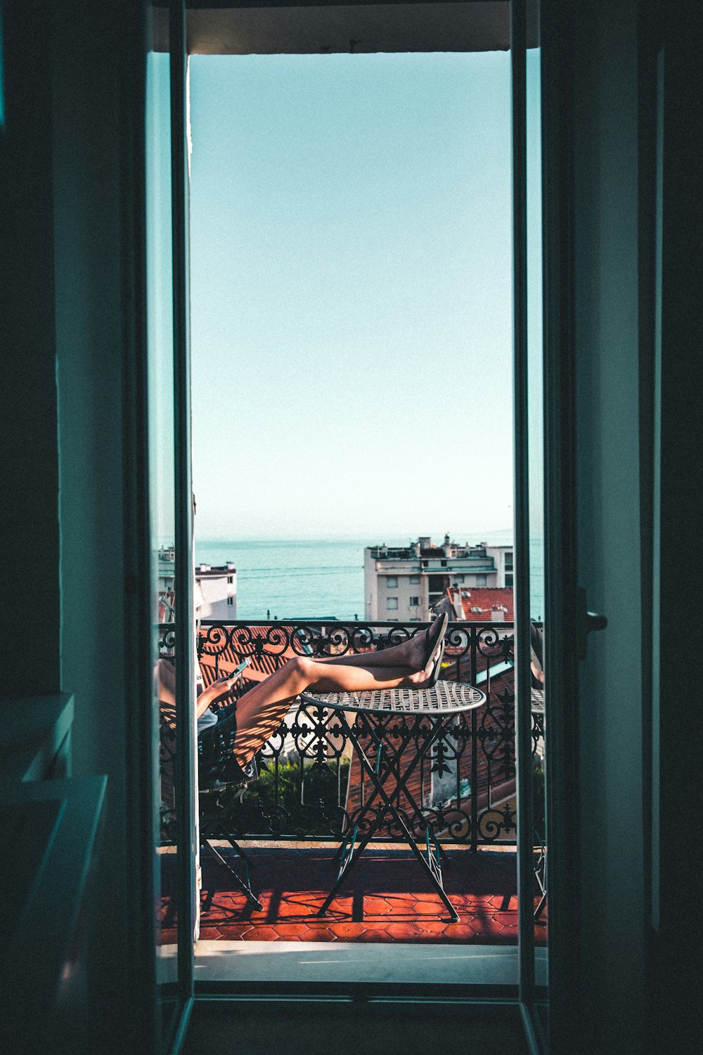 Balcony door with mesh screen for airflow